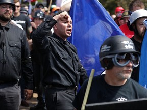 White nationalists, neo-Nazis and members of the "alt-right" exchange insults with counter-protesters as they attempt to guard the entrance to Lee Park during the "Unite the Right" rally August 12, 2017 in Charlottesville, Virginia.  (Chip Somodevilla/Getty Images)