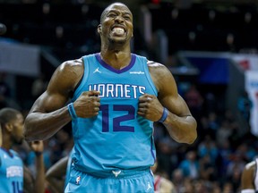 Charlotte Hornets center Dwight Howard reacts as the Hornets play the Washington Wizards in the second half of an NBA basketball game in Charlotte, N.C., Wednesday, Nov. 22, 2017. (AP Photo/Nell Redmond)