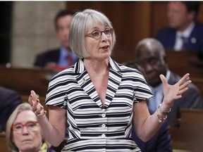 Minister of Employment, Workforce Development and Labour Patty Hajdu rises in the House of Commons during Question Period in Ottawa on Monday, June 11, 2018. Rising provincial minimum wages has cut into the reach of the Liberal government's oft-touted increase to summer jobs spending by reducing the number of hours being funded this year.