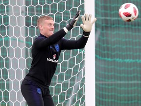 England's Jordan Pickford makes a save during a training session on Tuesday.