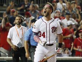 Washington Nationals Bryce Harper celebrates his winning hit during the Major League Baseball Home Run Derby, Monday, July 16, 2018 in Washington. (AP Photo/Alex Brandon)