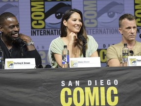 Sterling K. Brown, from left, Olivia Munn and Thomas Jane attend the 20th Century Fox "Predator" panel on day one of Comic-Con International on Thursday, July 19, 2018, in San Diego.