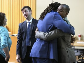 A.J. Johnson, left, and Michael Williams hug after a jury acquitted them of aggravated rape charges Friday, July 27, 2018, in Knoxville, Tenn. (Michael Patrick/Knoxville News Sentinel via AP)