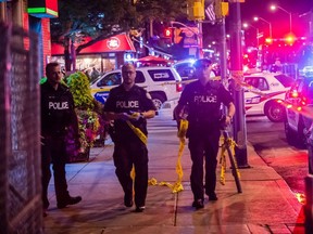 As many as nine people have been rushed to hospital with gunshot wounds after a gunman opened fire on Danforth avenue West of Logan Avenue Sunday evening shortly after 10 PM. (VICTOR BIRO PHOTO)