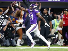 Stefon Diggs of the Minnesota Vikings scores a touchdown as time expires against the New Orleans Saints during the second half of the NFC Divisional Playoff game at U.S. Bank Stadium on January 14, 2018 in Minneapolis, Minnesota. (Jamie Squire/Getty Images)