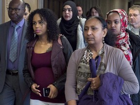 Abdoul Abdi's sister Fatouma Abdi, second from left, leaves Federal Court with supporters after a hearing to determine whether deportation proceedings should be halted for the former child refugee, in Halifax on Feb. 15, 2018.