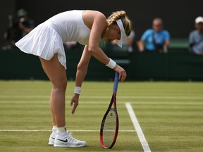 Canada's Eugenie Bouchard reacts while playing Australia's Ashleigh Barty in their women's singles second round match on the fourth day of the 2018 Wimbledon Championships at The All England Lawn Tennis Club in Wimbledon, southwest London, on July 5, 2018. (Oli Scarff/Getty Images)