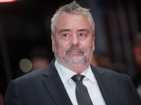 (FILES) In this file photo taken on February 17, 2018 French director Luc Besson poses on the red carpet upon arrival for the premiere of the film "Eva" presented in competition during the 68th Berlinale film festival in Berlin. A second woman has accused the French movie mogul Luc Besson of sexual assault, according to reports, two months after a young actress alleged he had raped her. The 49-year-old casting director said that she was assaulted by the director "every time I took the lift with him", and that he also demanded sexual favours from her on set.