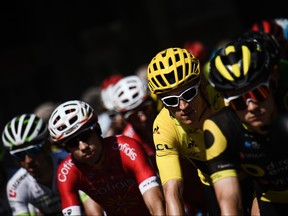 Great Britain's Geraint Thomas (C-R), wearing the overall leader's yellow jersey takes the start with the pack of the 16th stage of the 105th edition of the Tour de France cycling race, between Carcassonne and Bagneres-de-Luchon, southwestern France, on July 24, 2018. (Jeff Pachoud/Getty Images)