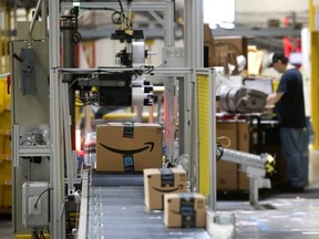 Packages pass through a scanner at an Amazon fulfillment center in Baltimore on Aug. 3, 2017. (Photo/Patrick Semansky)