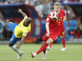 Brazil's Fernandinho, left, and Belgium's Kevin De Bruyne challenge for the ball during their quarterfinal match at the 2018 World Cup in the Kazan Arena, in Kazan, Russia, Friday, July 6, 2018. (AP Photo/Frank Augstein)