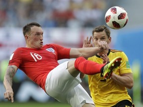 England's Phil Jones left controls a ball in front of Belgium's Jan Vertonghen during the third place match between England and Belgium at the 2018 soccer World Cup in the St. Petersburg Stadium in St. Petersburg, Russia, Saturday, July 14, 2018.