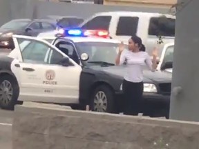 Amber Neal's arrest at gunpoint by Los Angeles police officers on Monday was captured on video by a bystander and had been viewed more than 2.4 million times on Twitter. (Twitter)