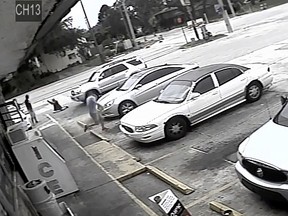 In this Thursday, July 19, 2018 image taken from surveillance video released by the Pinellas County Sheriff's Office, Markeis McGlockton, far left, is shot by Michael Drejka during an altercation in the parking lot of a convenience store in Clearwater, Fla. (Pinellas County Sheriff's Office via AP)