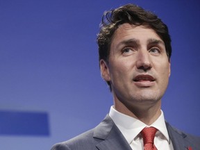 Canadian Prime Minister Justin Trudeau speaks at a press conference after a summit of heads of state and government at NATO headquarters in Brussels, Belgium, Thursday, July 12, 2018. NATO leaders gather in Brussels for a two-day summit.