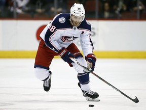 In this Jan. 25, 2018, file photo, Columbus Blue Jackets centre Boone Jenner skates with the puck against the Arizona Coyotes in Glendale, Ariz. (AP Photo/Ross D. Franklin, File)