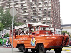 Boston Duck Tours vehicle with tourists enters Boylston Street in Boston with a view of one of the city's tallest buildings, the Prudential Center, in the background in this September 22, 2001 file photo. (JOHN MOTTERN/AFP/Getty Images)