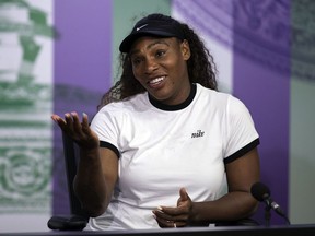 U.S. tennis player Serena Williams reacts, during a press conference ahead of the Wimbledon Tennis Championships in London, Sunday July 1, 2018.