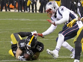 In this Sunday, Dec. 17, 2017, file photo, Pittsburgh Steelers tight end Jesse James (81) loses his grip on the football after crossing the goal line on a pass play against the New England Patriots in Pittsburgh. (AP Photo/Don Wright, File)