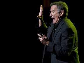 In this Nov. 8, 2012 file photo, Robin Williams performs at the 6th Annual Stand Up For Heroes benefit concert for injured service members and veterans in New York. (Charles Sykes/Invision/AP, File)