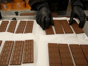 A worker prepares to package freshly made marijuana infused chocolate bars on January 16, 2018 in Oakland, California. (Justin Sullivan/Getty Images)