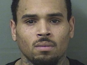 This booking photo provided by Balm Beach County Sheriff's Office shows Chris Brown.  The singer walked off stage after his concert in Florida and into the hands of waiting sheriff's deputies, who arrested him on a felony battery charge and booked him into the Palm Beach County Jail. A sheriff's spokeswoman said the entertainer was released after posting $2,000 bond on the battery charge issued by the sheriff's office in Hillsborough County. No details about the allegations in the arrest warrant were immediately available.  (Balm Beach County Sheriff's Office via AP) ORG XMIT: NY109