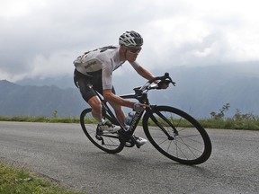 Britain's Chris Froome speeds down Col de Val Louron-Azet pass during the 17th  stage of the Tour de France Wednesday July 25, 2018. (AP Photo/Christophe Ena)