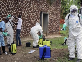 Congolese health officials prepare to disinfect people and buildings at the general referral hospital in Mbandaka, Congo on Thursday, May 31, 2018. (AP Photo/John Bompengo)