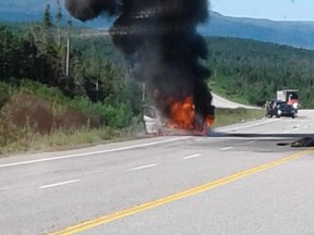A car is seen on fire after striking and killing a moose on a Newfoundland highway near Channel-Port aux Basques, N.L. on Friday, July 20, 2018 in this handout photo. A car burst into flames this morning after striking and killing a moose on a Newfoundland highway. RCMP spokesman Sgt. Terry Alexander says the single-vehicle collision happened on the Trans-Canada Highway about an hour's drive north of Channel-Port aux Basques.THE CANADIAN PRESS/HO