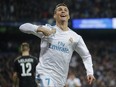Real Madrid's Cristiano Ronaldo celebrates his side's 2nd goal during a Champions League match against Paris Saint Germain at the Santiago Bernabeu stadium in Madrid, Spain on Feb. 14, 2018.