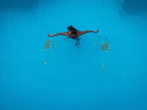 A recent spate of drowning incidents in Ontario and Quebec has led to renewed calls for more vigilance around water and making swimming lessons part of the school curriculum. A woman swims in a pool at a hotel in Kelowna, B.C., on Wednesday, September 6, 2017. (The Canadian Press/Darryl Dyck)
