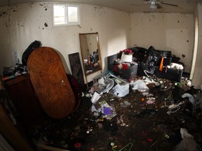 Belongings are scattered in the flooded basement apartment in which a woman died Tuesday as clean-up efforts continued Thursday, July 26, 2018, in Englewood, Colo. A friend of the renter died in the basement apartment after a small but intense storm flooded it. Officials say Rachael Haber, 32, got trapped and drowned. (AP Photo/David Zalubowski)