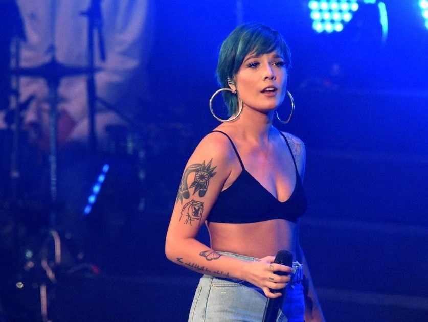 Sorry my boobs came out': Halsey suffers wardrobe malfunction