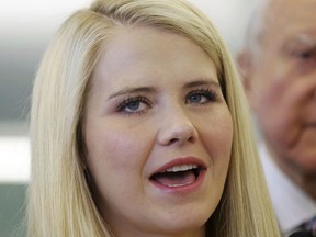 In this July 6, 2017, file photo, kidnapping victim Elizabeth Smart speaks to reporters during a tour of the state crime lab in Taylorsville, Utah.