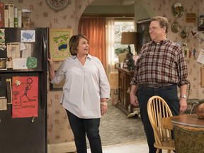 This image released by ABS shows Roseanne Barr, left, and John Goodman in a scene from the comedy series "Roseanne." ABC's "Roseanne" revival is in the running for Emmy nominations Thursday, but will TV academy voters overlook its star's racist tweet that brought the sitcom to an abrupt end?