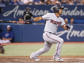 Eduardo Escobar of the Minnesota Twins hits a home run against the Toronto Blue Jays at Rogers Centre on July 24, 2018 in Toronto. (Tom Szczerbowski/Getty Images)