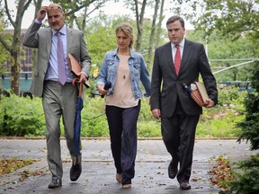 TV actress Allison Mack, center, arrives with her legal team at federal court in Brooklyn, Wednesday July 25, 2018, in New York. (AP Photo/Bebeto Matthews)