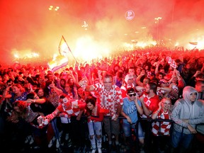 Croatian fans cheer while watching the semifinal match between Croatia and England at the 2018 soccer World Cup, in Zagreb, Croatia on July 11, 2018. (AP Photo/Nikola Solic, File)