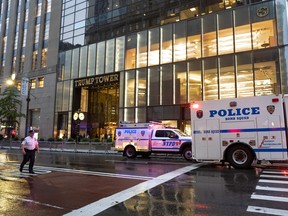 Police begin to reopen 5th Avenue after they investigated the report of a "suspicious item" inside Trump Tower, Friday, July 27, 2018, in New York. Police say suspicious items have been determined to be harmless. (AP Photo/Craig Ruttle)