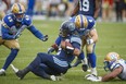 QB James Franklin is downed in the Argos’ Saturday loss to Winnipeg at BMO Field. They face the Bombers on the road on Friday night. (The Canadian Press)