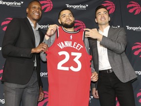 Raptors’ Fred VanVleet (centre) along with president Masai Ujiri (left) and general manager Bobby Webster were all smiles yesterday after announcing the two-year deal for the point guard.