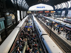 Passengers crowd the platform at the main train station in the northern German city of Hamburg on April 16, 2010. (Philipp Guelland/Getty Images)