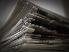 A pile of newspapers and magazines in Paris on Jan. 14, 2015. (Martin Bureau/Getty Images)