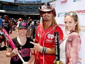 Musician Bret Michaels (center) poses with daughters Jorja Sychak (L) and Raine Sychak (R) during the 26th Annual City of Hope Celebrity Softball Game at First Tennessee Park on June 7, 2016 in Nashville, Tennessee.  (Rick Diamond/Getty Images for City Of Hope)
