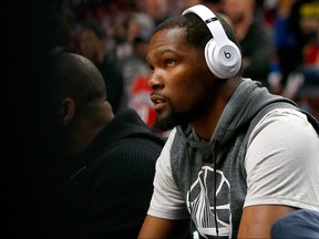 Kevin Durant of the Golden State Warriors sits on the bench during pregame warm ups before Game Three of the Western Conference Quarterfinals of  the 2017 NBA Playoffs against the Portland Trail Blazers at Moda Center on April 22, 2017 in Portland, Oregon. (Jonathan Ferrey/Getty Images)