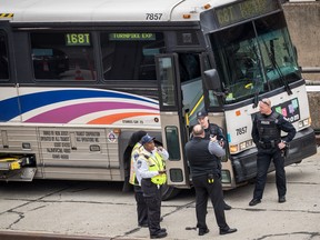 Law enforcement officials gather near the scene of a New Jersey Transit bus that was involved in a morning crash near the Manhattan entrance to the Lincoln Tunnel, May 18, 2018 in New York City. (Drew Angerer/Getty Images)