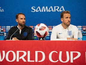Gareth Southgate, Manager of England and Harry Kane of England speak during an England press conference at Samara Arena on July 6, 2018 in Samara, Russia. (Matthias Hangst/Getty Images)