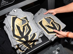 T-shirts with the team logo for the Vegas Golden Knights are folded and stacked after the  name was announced for the Las Vegas NHL franchise at T-Mobile Arena on November 22, 2016 in Las Vegas. (Ethan Miller/Getty Images)