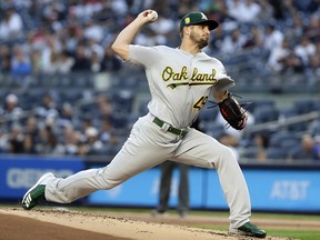 In this May 11, 2018, file photo, Oakland Athletics' Kendall Graveman delivers a pitch against the New York Yankees in New York. (AP Photo/Frank Franklin II, File)