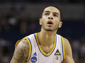 In this March 17, 2011, file photo, UCLA's Tyler Honeycutt looks to shoot against Michigan State during the NCAA college basketball tournament in Tampa, Fla.